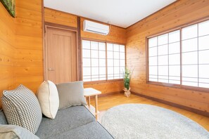 Private Vacation Home, Komatsugahara 83 | Living area | Flat-screen TV, fireplace - Angel Forest Fuji Komatsugahara (Izunokuni)