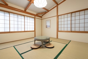 Private Vacation Home, Komatsugahara 3B | Living area | Flat-screen TV, fireplace