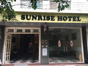 The Sunrise Hotel entrance with a checkered floor pattern and a signboard displaying the hotel's name. - Sunrise Hotel (Hanoi)