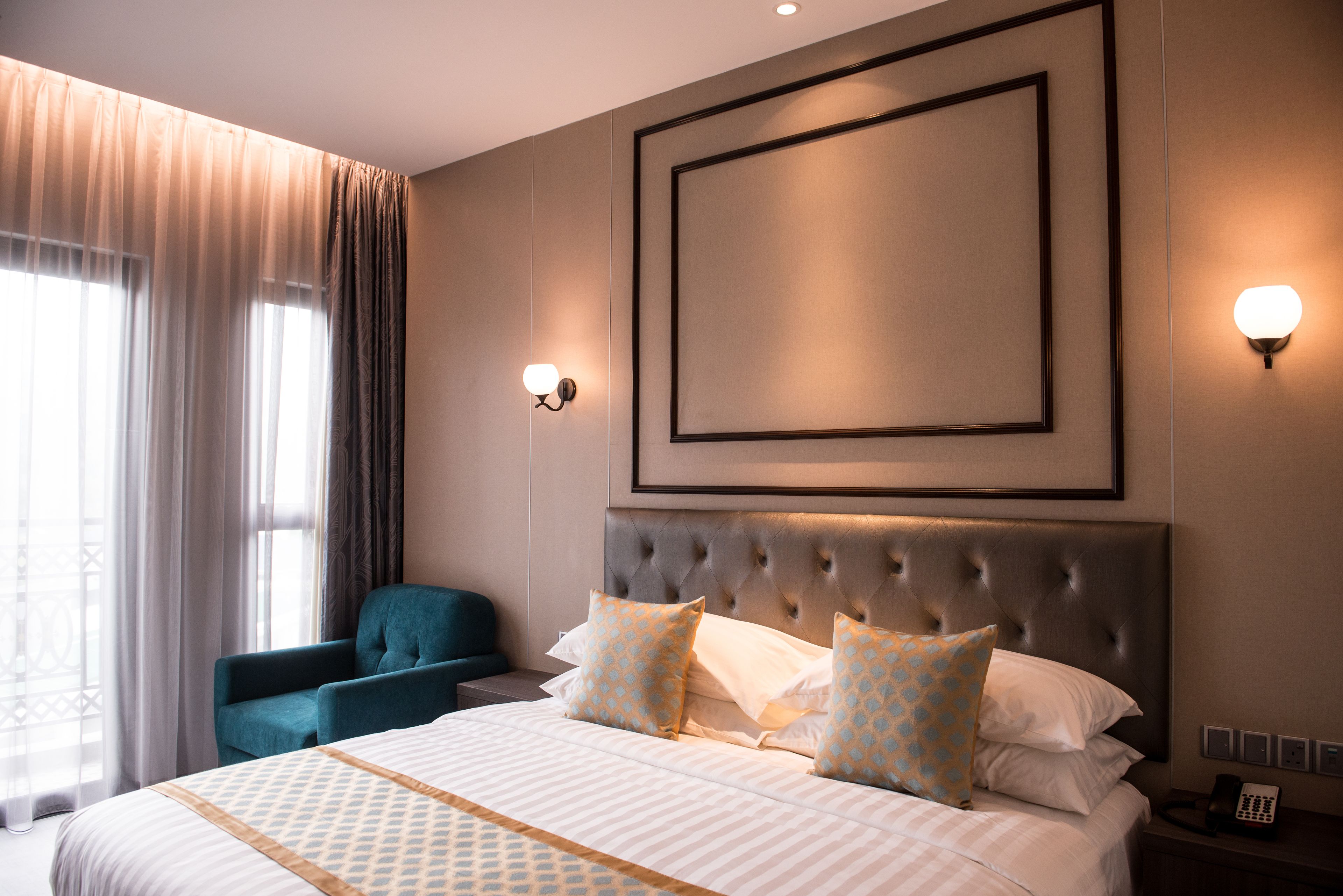 deluxe room | minibar, in-room safe, desk, laptop workspace