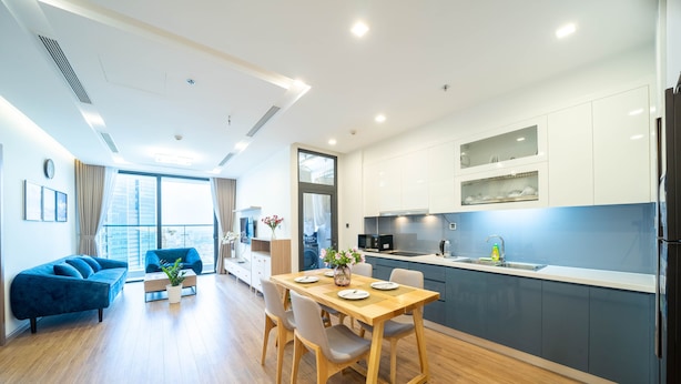 A modern apartment with a dining area, kitchen, and living space. - Jaan Apartment 29 Lieu Giai (Hanoi)