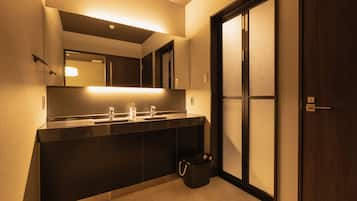 Separate bathtub and shower, free toiletries, hair dryer, slippers