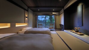 A modern hotel room with two beds, a balcony, and a view of the outdoors. - Oyado Morinone - Adults Only (Kaminoyama)