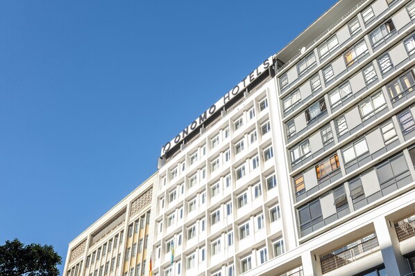 A multi-story hotel building with a prominent sign reading 'HOTEL'.