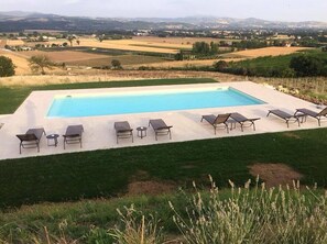 Seasonal outdoor pool, pool umbrellas, pool loungers
