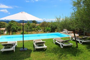 Outdoor pool, open 9:00 AM to 9:00 PM, pool loungers