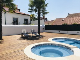 Seasonal outdoor pool, open 8:00 AM to 8:00 PM, pool umbrellas