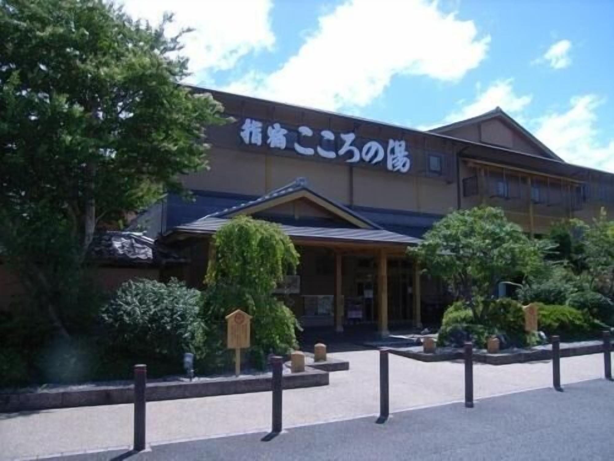 A building with a sign that reads "Hotel".