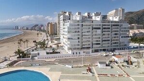 A hotel with multiple floors, a pool, and a beach view. - PRADO, A-7º-72 PK INT 83 (Cullera)