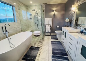 Combined shower/tub, hair dryer, towels, soap