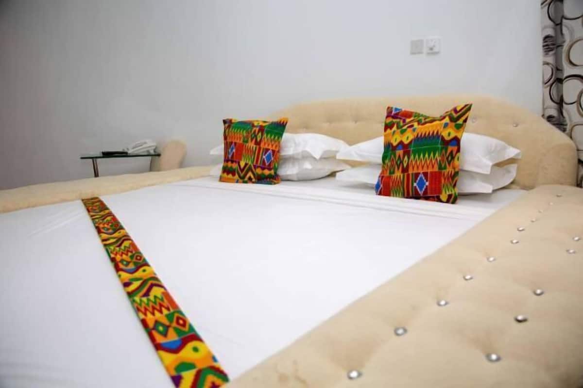 Premium bedding, desk, laptop workspace, iron/ironing board