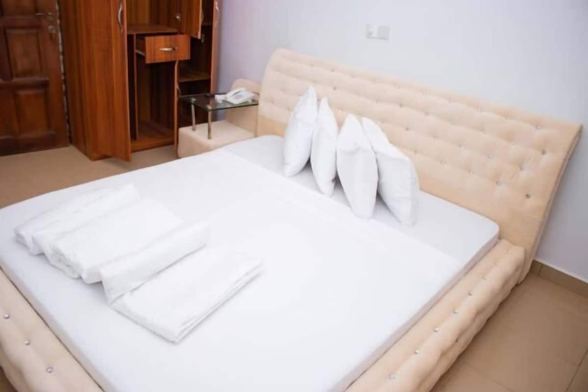 Premium bedding, desk, laptop workspace, iron/ironing board