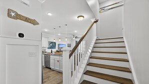 A modern kitchen with white cabinets, a wooden countertop, and a built-in oven. - Pet Friendly | Private Pool | Walk to Beach | Lagoon Views (Hilton Head Island)