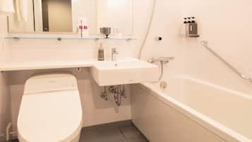 Un bagno moderno con WC, lavabo e vasca da bagno.