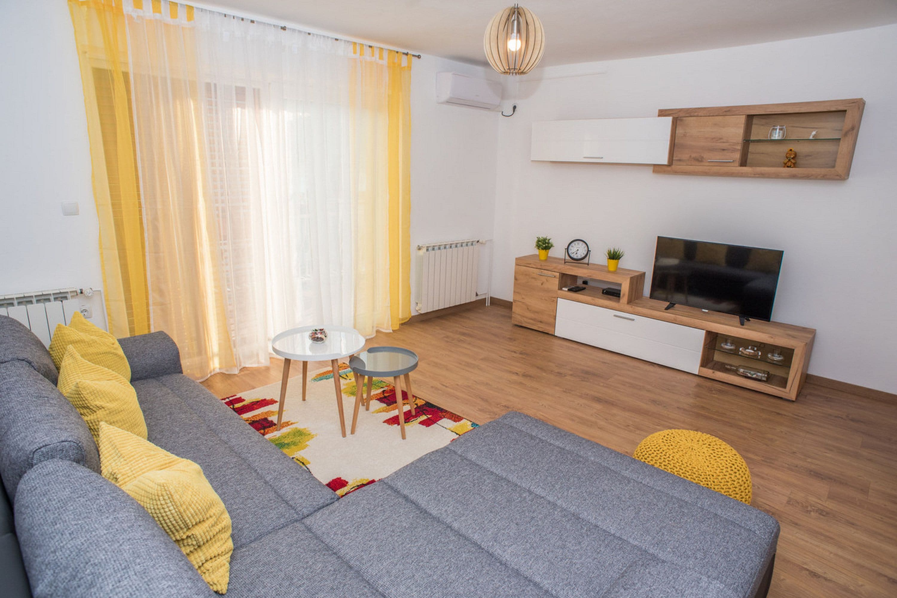 Apartment, 1 Bedroom, Lake View | Living room | Flat-screen TV