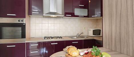 Apartment, 2 Bedrooms | Private kitchen | Fridge, microwave, oven, stovetop