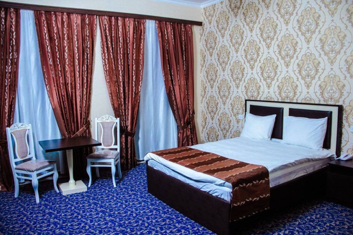 Desk, laptop workspace, blackout curtains, free WiFi