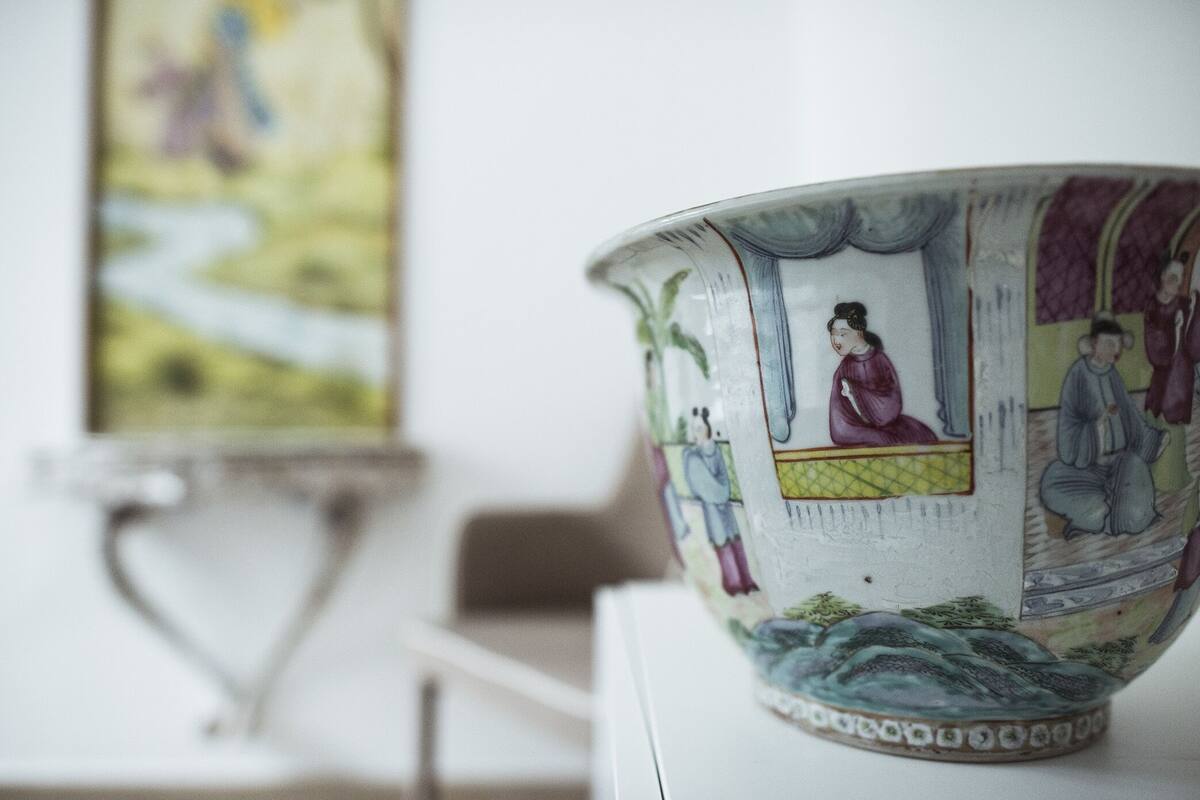 A ceramic bowl with detailed artwork on its exterior.