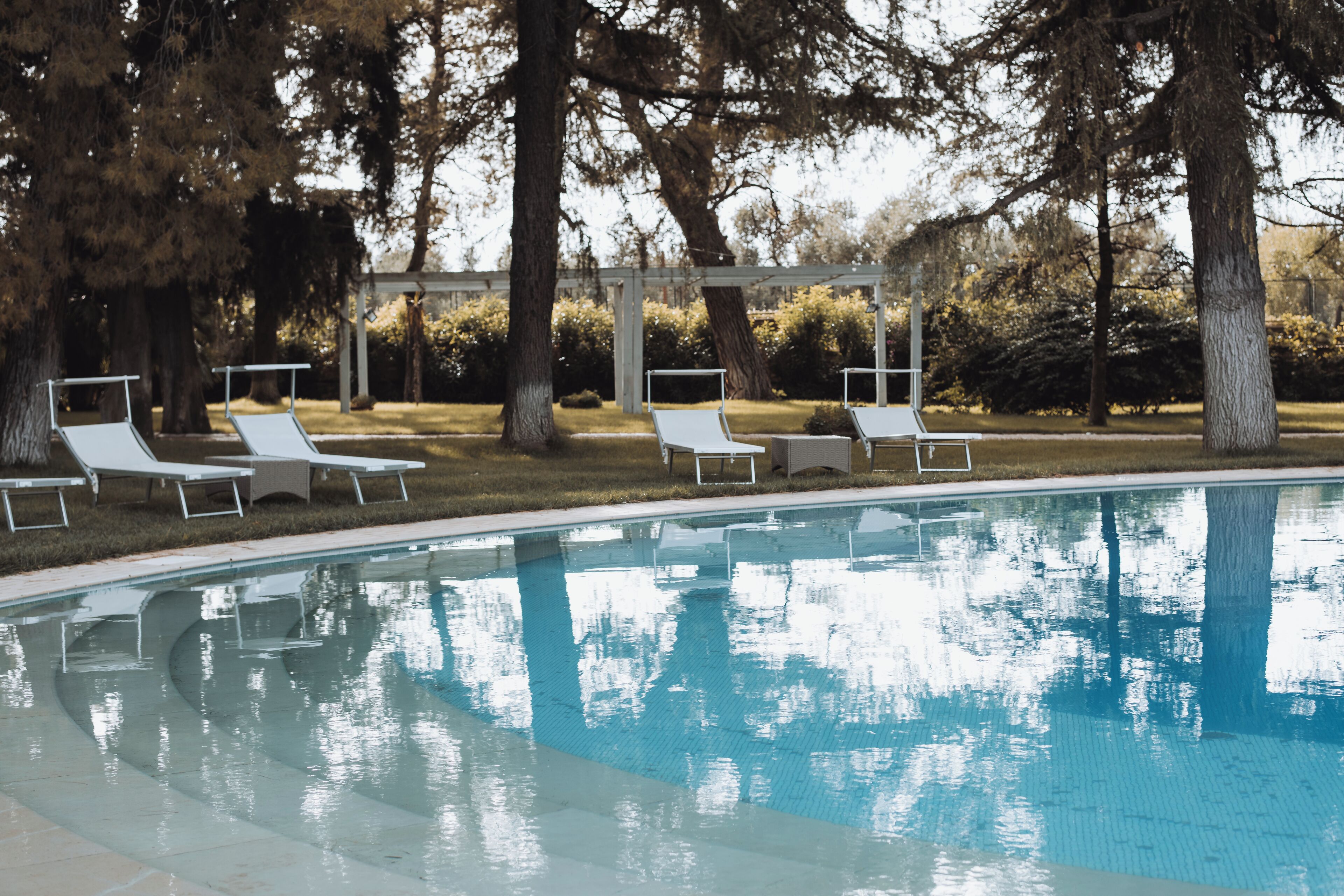 Seasonal outdoor pool, a waterfall pool, pool loungers