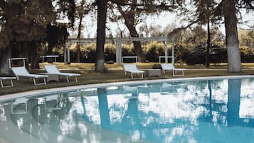 Seasonal outdoor pool, a waterfall pool, pool loungers