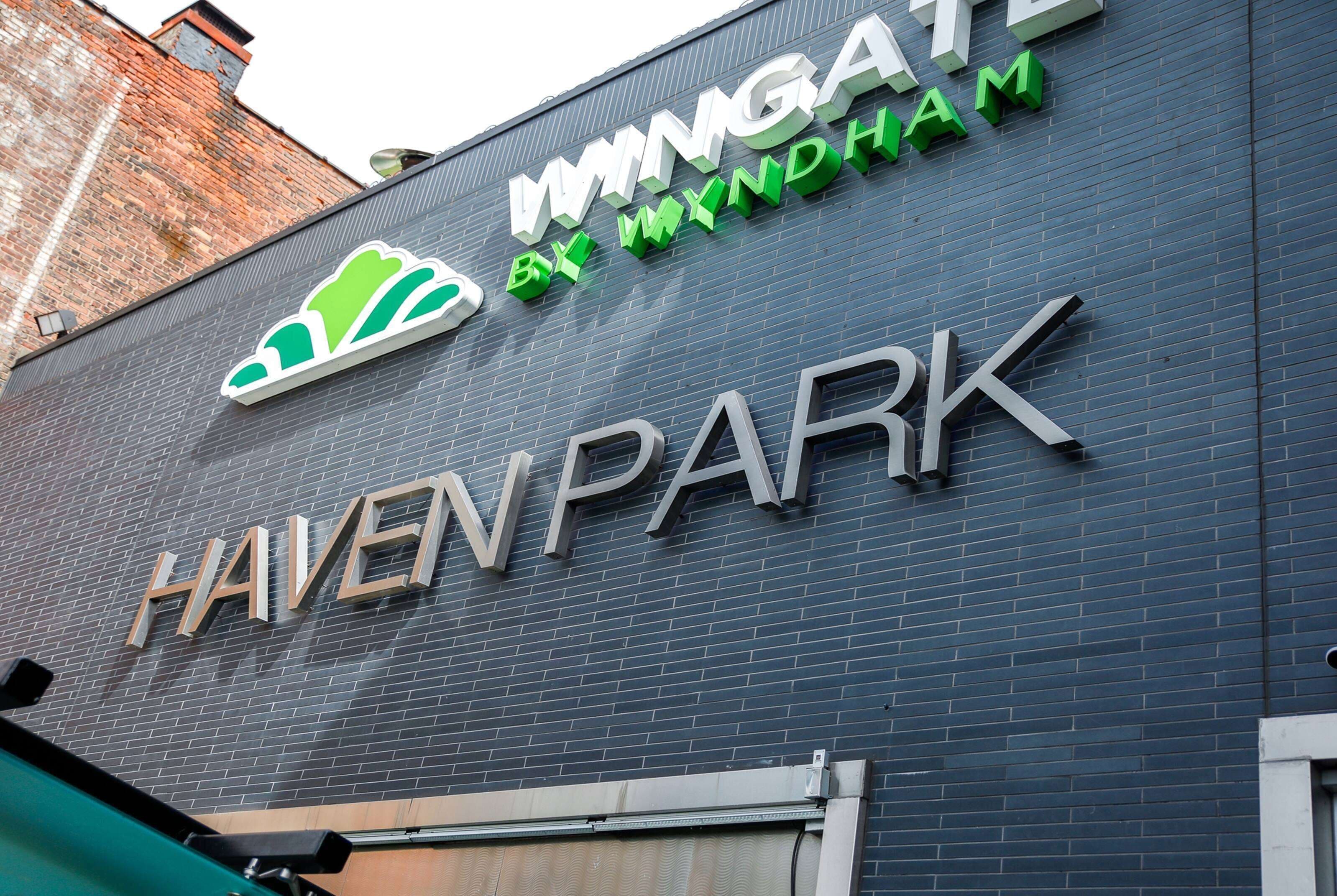 A building with the sign "HAVEN PARK" and "IMMIGATE BY MYNDHAM" on the facade.