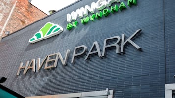 A building with the sign "HAVEN PARK" and "IMMIGATE BY MYNDHAM" on the facade.