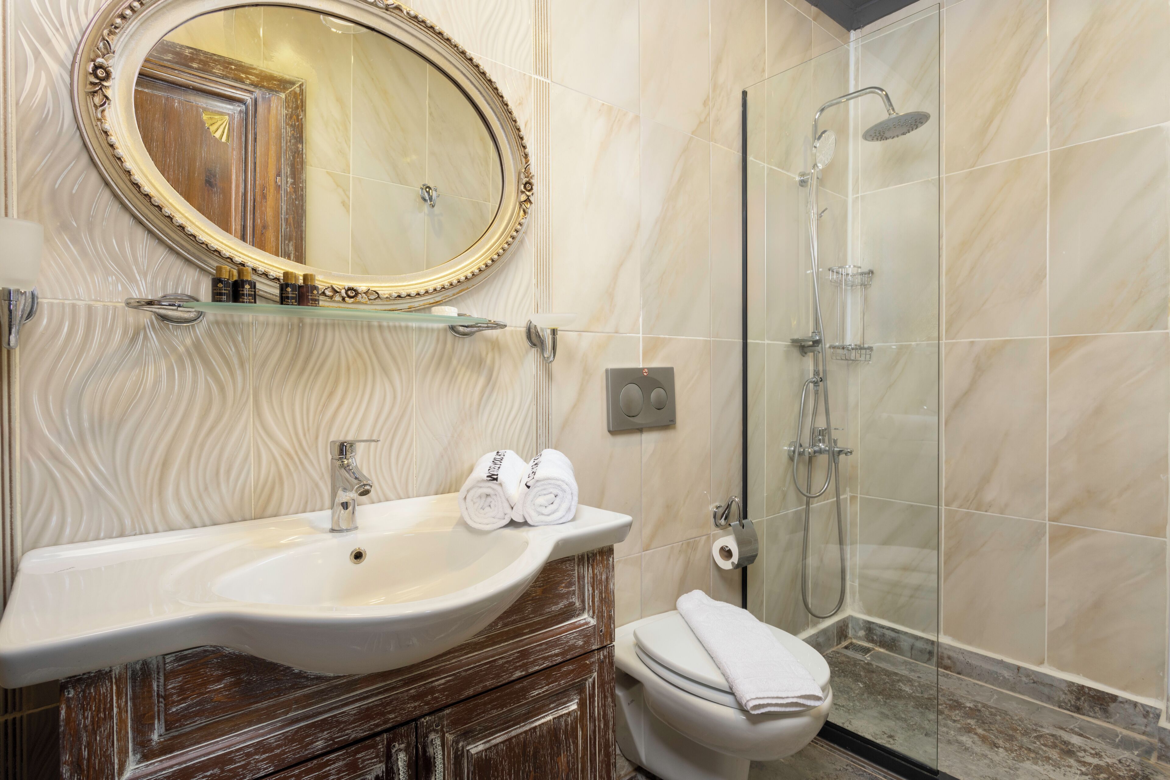 deluxe room | bathroom | shower, free toiletries, hair dryer, slippers