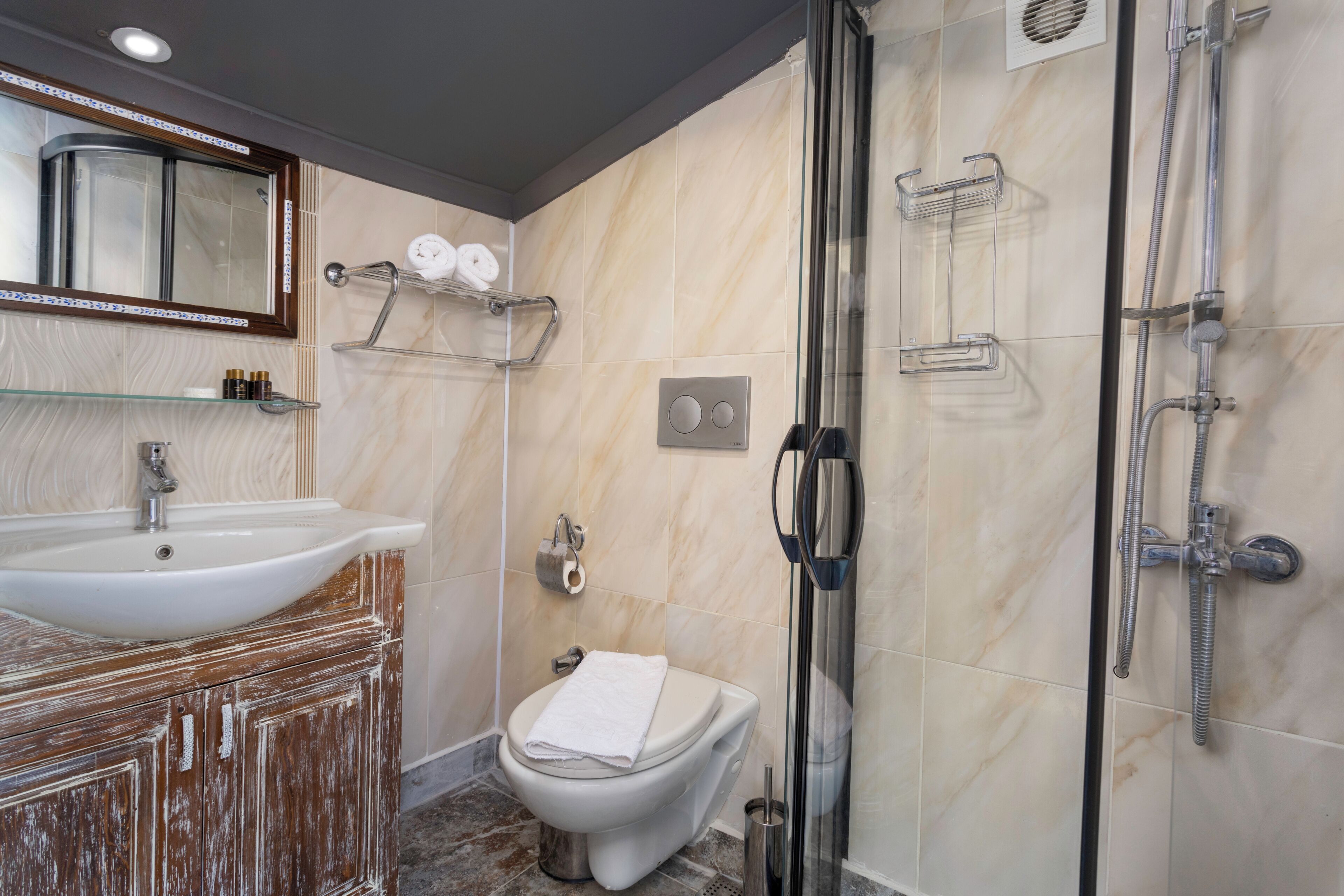 economy double room | bathroom | shower, free toiletries, hair dryer, slippers