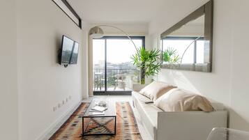 Design Loft | Living room | 36-inch flat-screen TV with cable channels, TV, Netflix
