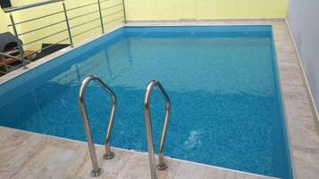 Seasonal outdoor pool, pool umbrellas, sun loungers