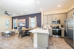 Full-sized fridge, oven, stovetop, dishwasher