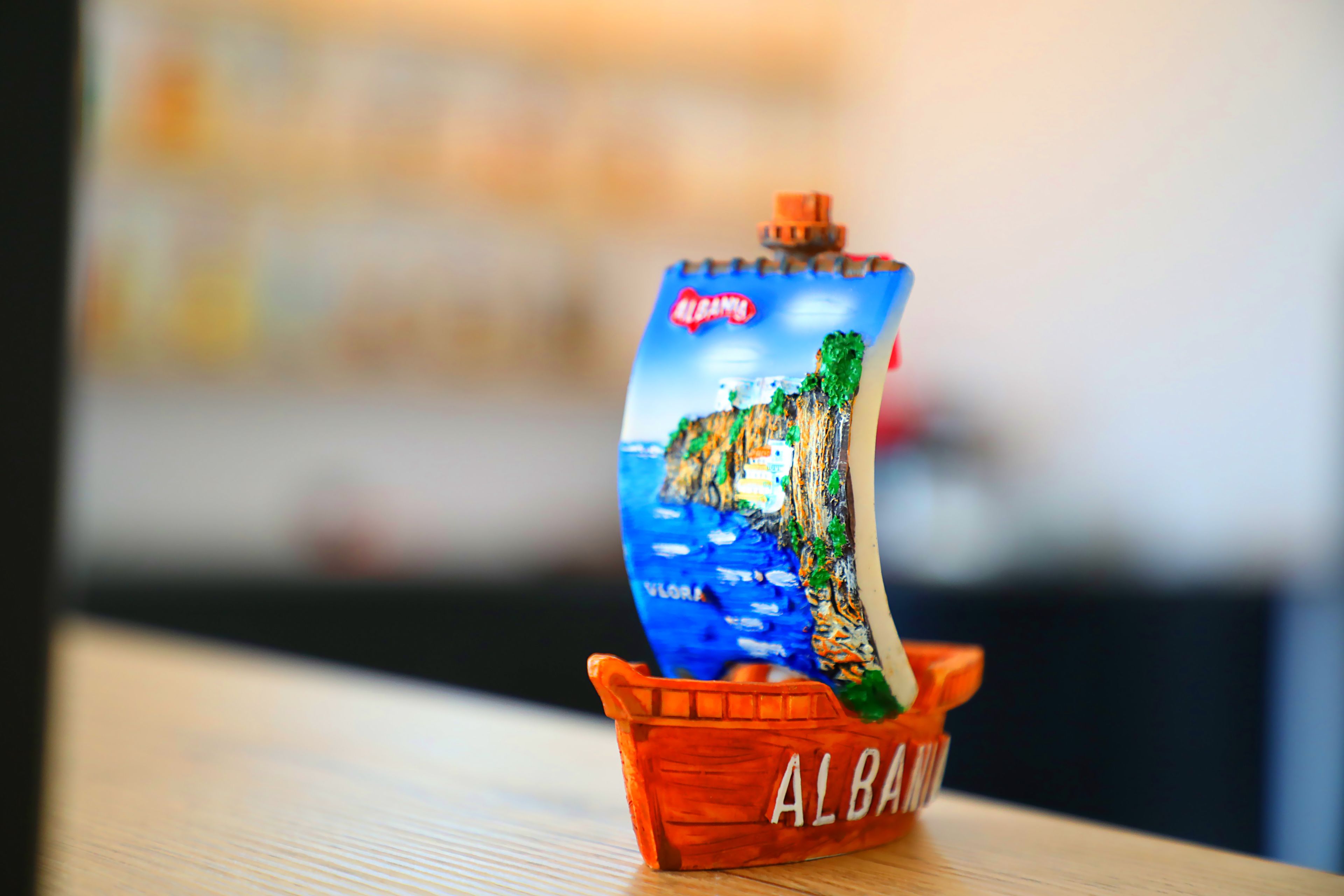 A small orange boat with the word "ALBAMA" on it.