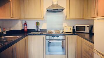 1 Bed Apartment by Zebra | Private kitchen | Full-sized fridge, microwave, oven, stovetop
