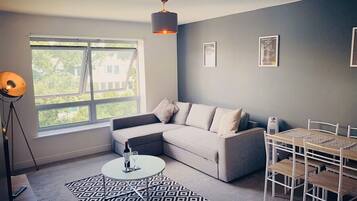 1 Bed Apartment by Zebra | Living room | Flat-screen TV