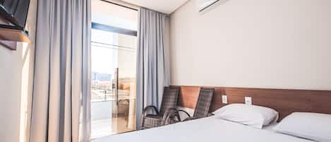 Family Room | Minibar, blackout drapes, iron/ironing board, free WiFi