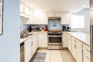 Enjoy cooking in this well-equipped kitchen with a microwave, toaster, coffee maker, and oven.
