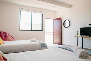 A hotel room with two beds, a TV, a mirror, and a window. - Great Villas Studios & Residences - The Kahlo (Playa del Carmen)