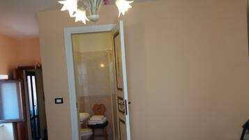 Shower, rainfall showerhead, hair dryer, towels