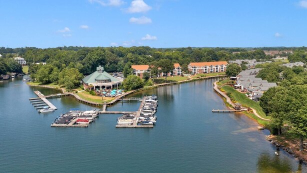 A riverside property with a gazebo, dock, and residential buildings. - Lake Norman Dream Condo! 1st Floor, Lake View Lake Norman Vacation Rental (Cornelius)