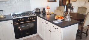 Coffee/tea maker, fridge, microwave, oven