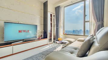 Apartment, 2 Bedrooms | Living area | 40-inch flat-screen TV with cable channels, TV
