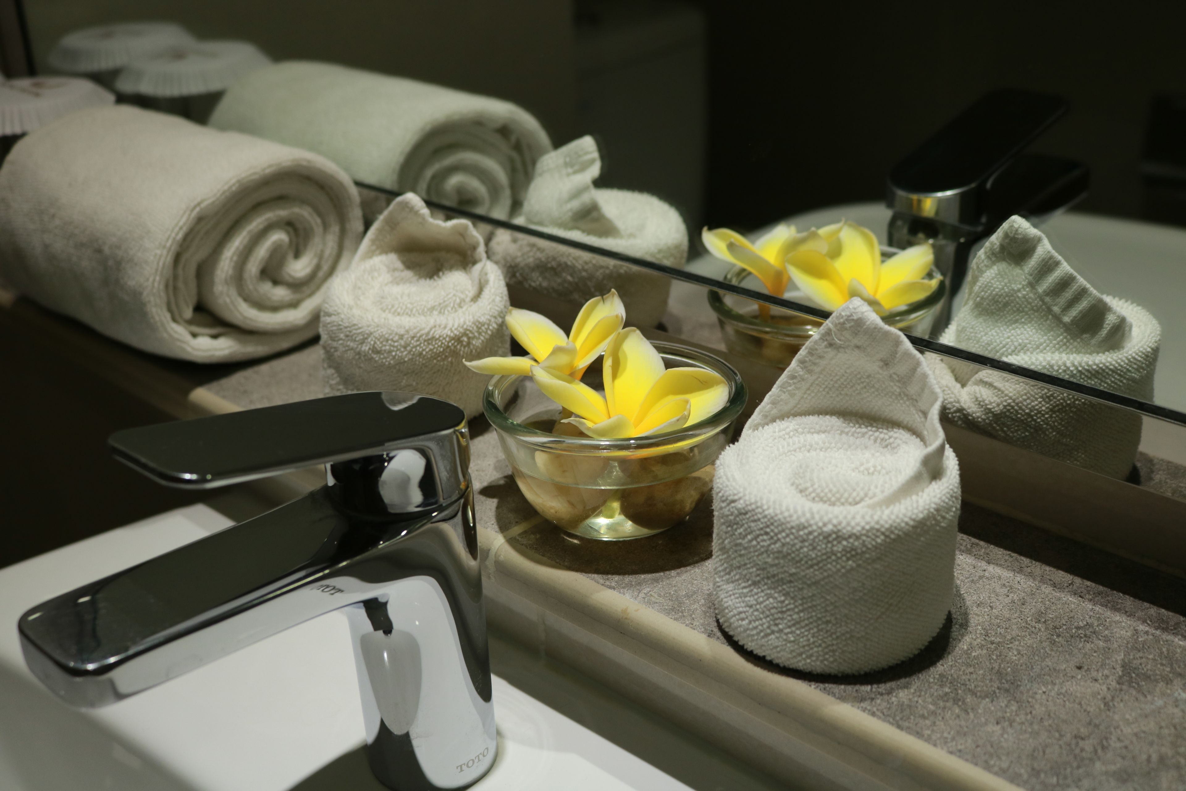 shower, hair dryer, slippers, towels