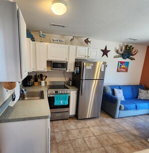 Fridge, microwave, stovetop, cookware/dishes/utensils