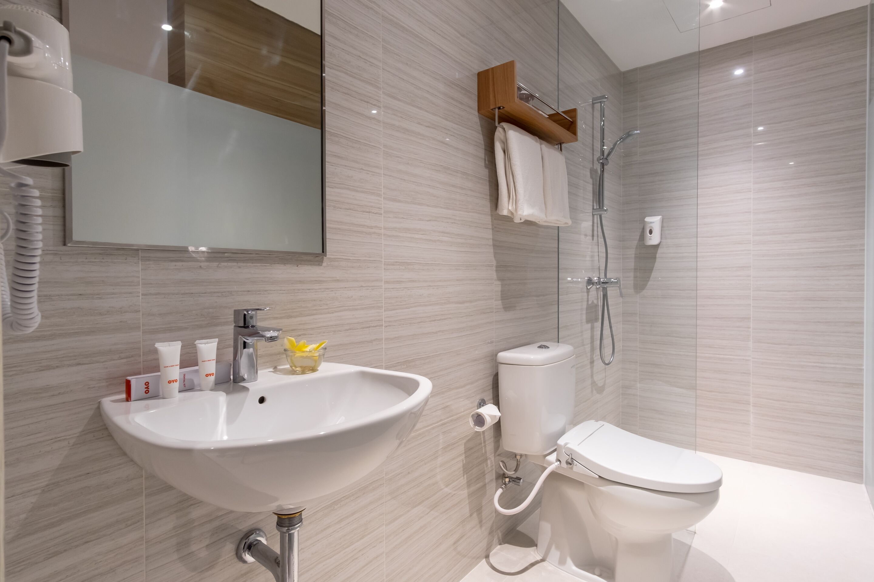 deluxe double room | bathroom | shower, slippers, towels