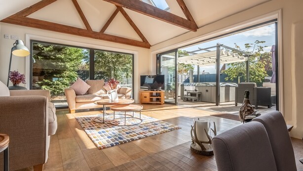 A spacious living room with a high ceiling, large windows, and a view of the outdoors. - Heath Cottage, Mattishall, Dereham , Norfolk (Mattishall)