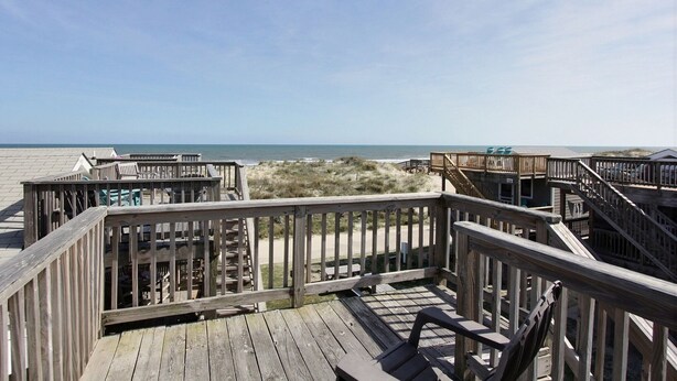 A wooden deck with a view of the beach and ocean. - A Dune Away is the place to stay! (HATTERAS)