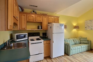 Fridge, microwave, stovetop, cookware/dishes/utensils