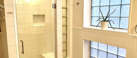 Shower, hair dryer, towels, soap