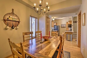 Enjoy meals in this cozy dining area with a large table and comfortable seating.