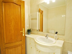 Bathtub, hair dryer, towels, soap
